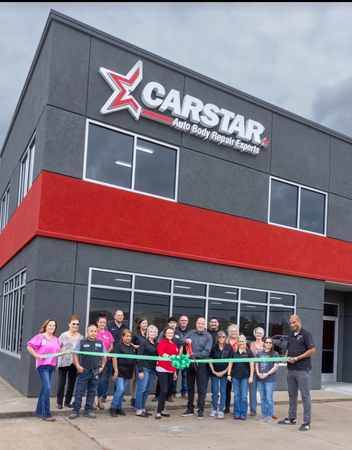 CARSTAR team at the outside ribbon cutting